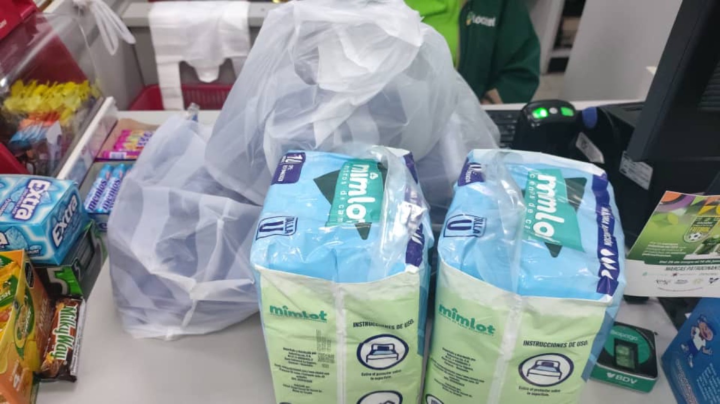 Health staff receiving donated medical supplies.