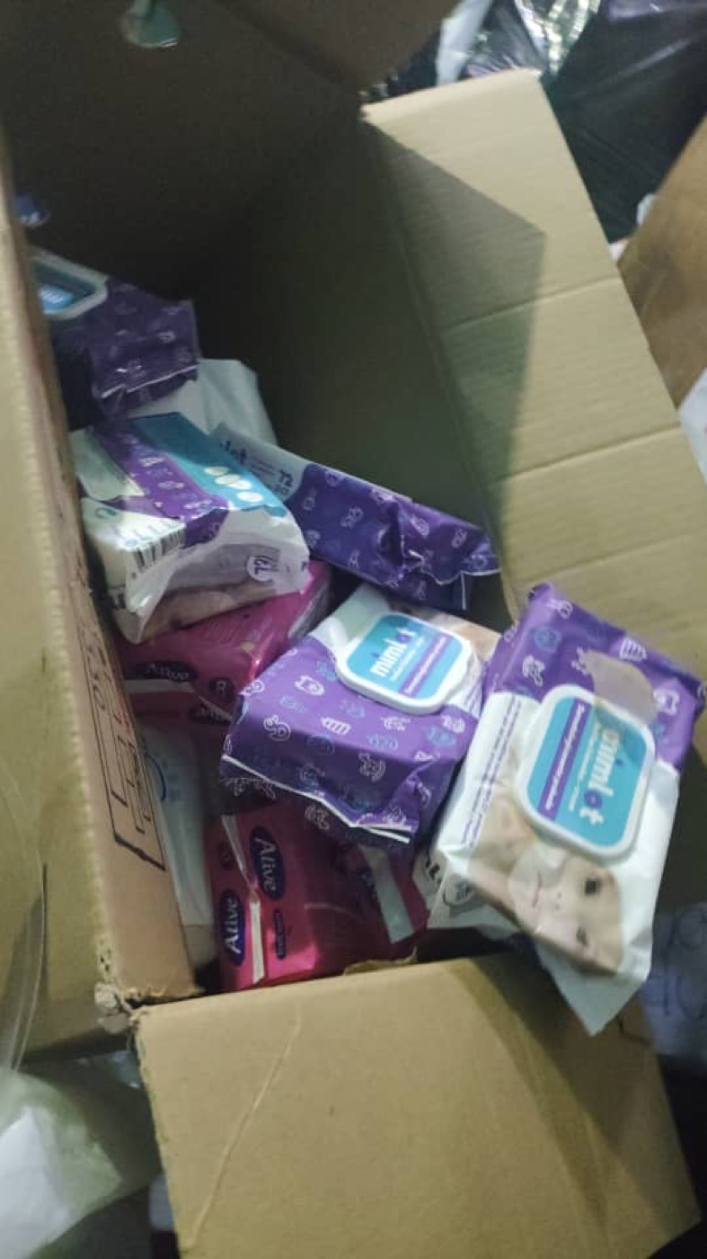 Boxes of gloves and tools at the collection point.